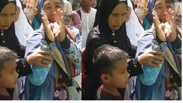 HAJI - Guru ngaji privat, warga Gang Mulya Plaju, Sofiah S (72) berpamitan dengan anak dan cucu serta keluarga yang menghantarnya menuju Asrama Haji Embarkasi Palembang, di Kompleks Jakabaring Sport City Palembang, Sabtu (25/4/2026) siang. Sofiah Bersama 303 jemaah haji dari KBIH Al Multazam Palembang ini tergabung dalam Kloter 4 Palembang dan berangkat Minggu (26/4/2026) pukul 12.00 langsung menuju Madinah.