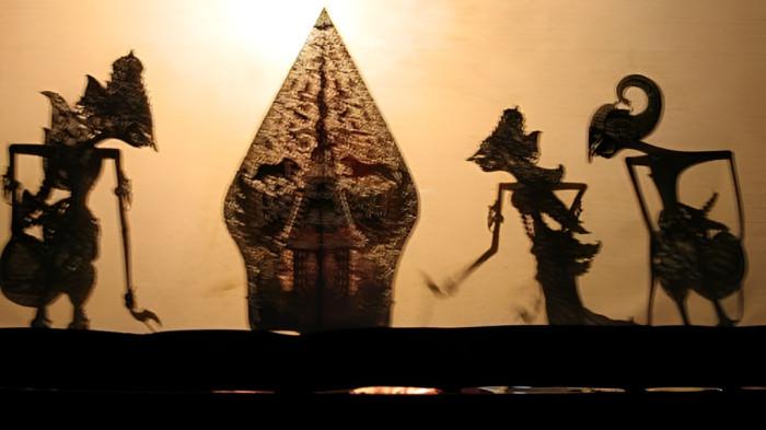WAYANG KULIT- Ilustrasi pertunjukan wayang kulit yang merupakan kesenian masyarakat Jawa.