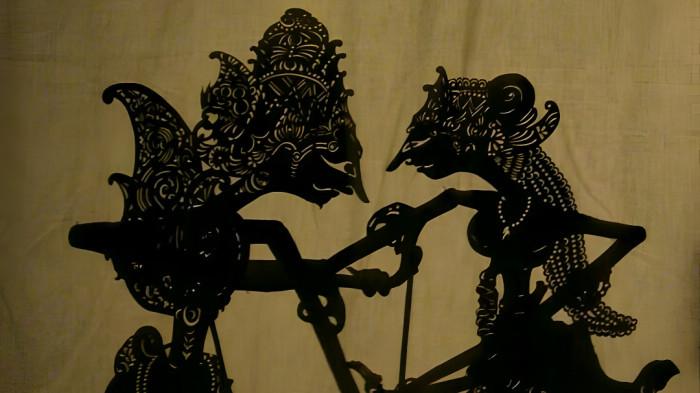 WAYANG KULIT- Ilustrasi sebuah pertunjukan atau penampilan wayang kulit yang merupakan tradisi kesenian masyarakat Jawa.