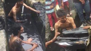 Dua-maling-helm-diceburkan-warga-ke-dalam-parit.jpg