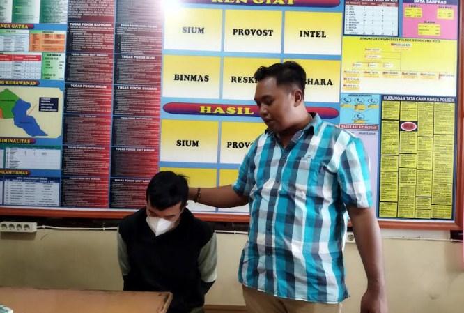 Pelaku-RP-saat-diamankan-ke-Polsek-Sidikalang.jpg