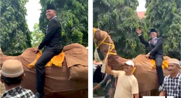 Suheri-naik-boneka-unta_DPRD-Asahan_.jpg