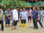 Kadis-SDABMBK-Kota-Medan-Gibson-Panjaitan-tengah-kemeja-kotak-kotak.jpg