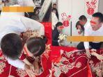 Pengantin-pria-di-Tiongkok-peluk-pendamping-pengantin-wanita_Pernikahan-Viral_.jpg