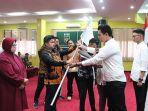 Penyerahan-bendera-petaka-kepada-Ketua-Umum-HIPMI-PT-UISU.jpg