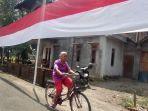 VIRAL-Ibu-Ini-Jahit-Bendera-Merah-Putih-780-Meter-Dipasang-Pakai-400-Tiang-hingga-Kelilingi-5-RT.jpg