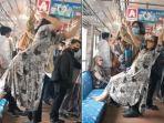 Viral-seorang-wanita-bergelantungan-di-KRL1.jpg