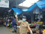 petugas-puskesmas-mengajak-warga-mengikuti-rapid-test.jpg