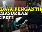 yanti-lumban-tobing-masukkan-kebaya-pengantin-ke-dalam-peti.jpg