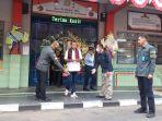 Wamenkumham-Edward-Omar-Sharif-Hiariej-putih-saat-mengunjungi-Rutan-Kelas-IIB-Kudus.jpg