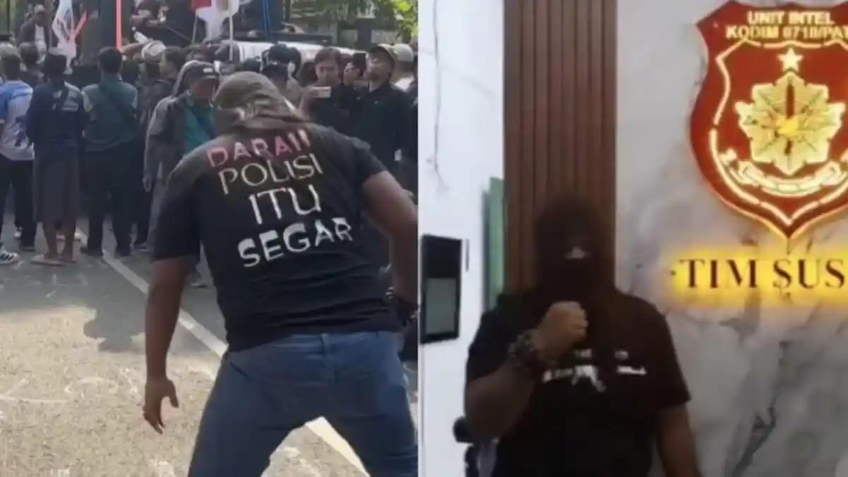 PROVOKATIF - Seorang pria melakukan aksi provokatif dengan memakai kaus bertuliskan 