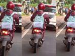 kreatifitas-seorang-ibu-hamil-saat-berkendara-sepeda-motor-sendirian.jpg
