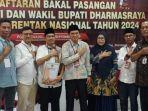 Adi-Gunawan-dan-Romi-Siska-Putra-saat-mendaftar-ke-KPU-Dharmasraya-1.jpg