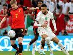 Gelandang-Belgia-Kevin-De-Bruyne-berlari-dengan-bola-melewati-pemain-depan-Maroko.jpg