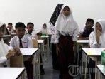 Sebanyak-100-siswa-SMP-mulai-masuk-sekolah-dan-mengikuti-belajar.jpg