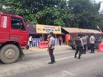 petugas-gabungan-melakukan-penjagaan-di-pos-penyekatan-larangan-mudik.jpg
