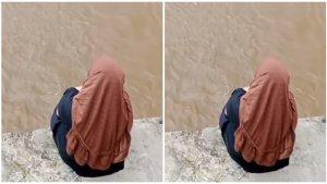 Seorang-perempuan-berhijab-duduk-di-bantaran-jembatan-dan-diduga-melakukan-percobaan-bunuh-diri.jpg