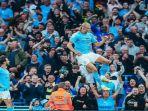 Aksi-Striker-Manchester-City-Erling-Haaland-melompat-tinggi-dalam-selebrasi-gol.jpg