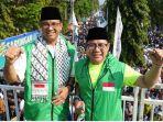 Anies-Baswedan-dan-Muhaimin-Iskandar-AMIN-saat-kegiatan-Jalan-Sehat-Santri-Sarungan.jpg