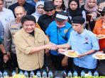 Gubernur-Sumsel-H-Herman-Deru-memberikan-tumpeng-kepada-perwakilan-kaum-buruh.jpg