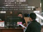 Julian-Melapor-ke-SPKT-Polrestabes-Palembang.jpg
