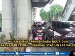 hujan-deras-pengendara-roda-dua-manfaatkan-berteduh-dibawah-stasiun-lrt-palembang.jpg