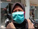 komariah-penjual-kembang-di-tpu-kamboja.jpg