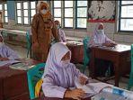 pembelajaran-tatap-muka-terbatas-ptmt-di-sman-4-oku.jpg