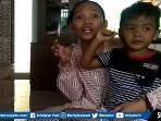 radit-atahya-rianto-bocah-yang-sempat-terbawa-bersama-mobil-ibu-elin-yang-dibawa-pencuri.jpg