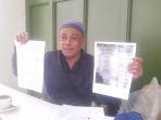 Habib-Muhammad-Perlihatkan-Berita-Acara.jpg
