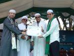 Kanwil-Kemenkumham-Sulteng-Hermansyah-Siregar-di-Alkhairaat-2024.jpg