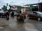 jl-tombolotutu-rusak-parah.jpg