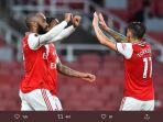 para-pemain-arsenal-merayakan-kemenangan-atas-liverpool-pada-laga-pekan-ke-36.jpg