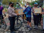 ganajr-gowes-bareng-bagi-bingkisan-petugas-posko-nataru.jpg