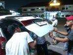 mobil-Ormas-ditembak.jpg
