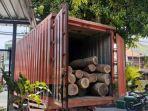 truk-bertuliskan-pos-indonesia-kayu-ilegal.jpg