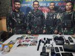 RILIS-Prajurit-Yonif-300BJw-dengan-barang-bukti-yang-diamankan-usai.jpg
