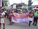pawai-pembangunan-di-meraukuke.jpg
