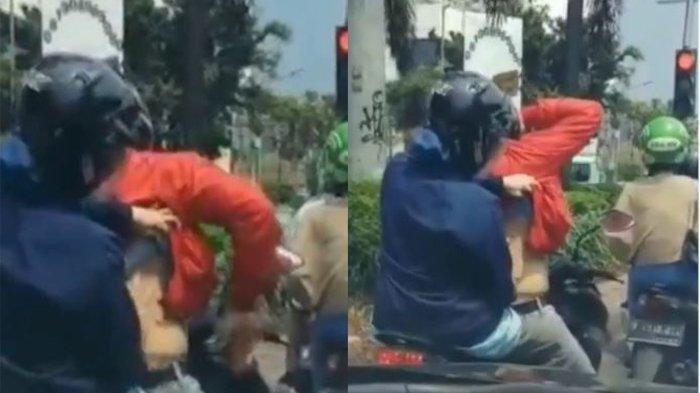 Video Viral, Istri Santai Keroki Suami di Atas Motor Saat Berhenti di Lampu Merah