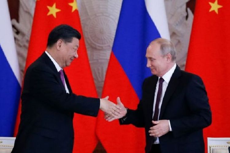 presiden-china-xi-jinping-dan-presiden-rusia-vladimir-putin-salaman.jpg