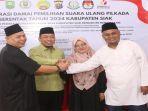 Calon-Bupati-dan-calon-wakil-bupati-Siak-salam-kompak.jpg