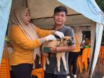 Pemilik_HPS_vaksinasi_rabies_di_momen_hari_rabies_sedunia_di_kota_dumai.jpg