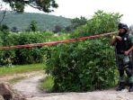 aparat-keamanan-berjaga-jaga-di-sekitar-sumur-kuburan-massal.jpg