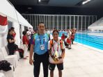 atlet-para-renang-riau-syuci-indriani-kembali-sumbang-medali-asian-para-games-2018_20181011_091859.jpg