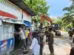 membongkar-bangunan-liar-di-Jalan-Bima-Kota-Pekanbaru.jpg