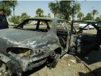 mobil-terbakar-di-irak-pembantaian-warga-sipil.jpg