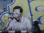 mural-presiden-jokowi-gunakan-masker-yang-menutupi-matanya.jpg