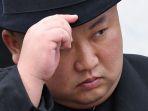 pemimpin-korea-utara-kim-jong-un-saat-menghadiri-upacara-peletakan-karangan-bunga.jpg