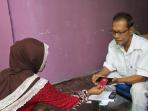 pencairan-bantuan-sosial-pemerintah-non-tunai-dengan-layanan-tcash-di-medan_20161006_085059.jpg