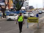 petugas-dari-satlantas-polresta-pekanbaru-menggelar-razia-kendaraan_20180821_212151.jpg